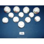 Twelve vintage porcelain floral patterned bed knob finials: four large and eight smaller.