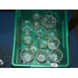Six Babycham glasses, four cut glass long stemmed wine glasses, lidded jars and footed dish.