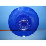 A large hand blown Bristol blue charger. 18" diameter.