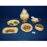 A quantity of Aynsley 'Orchard Gold' china including lidded vase, jug, tray, plate,