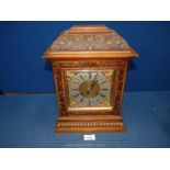 A Pine and Mahogany cased Bracket Clock/Mantle Clock having carved details with trailing flowering