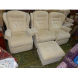 A beige upholstered Lounge Suite comprising a two seater settee and a single fireside Chair and