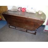 An Oak circa 1800 gate-leg drop-leaf Table of large dimensions, one leaf absent,