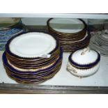 A Coalport part dinner service set in white with a dark blue and gold coloured edge to include;