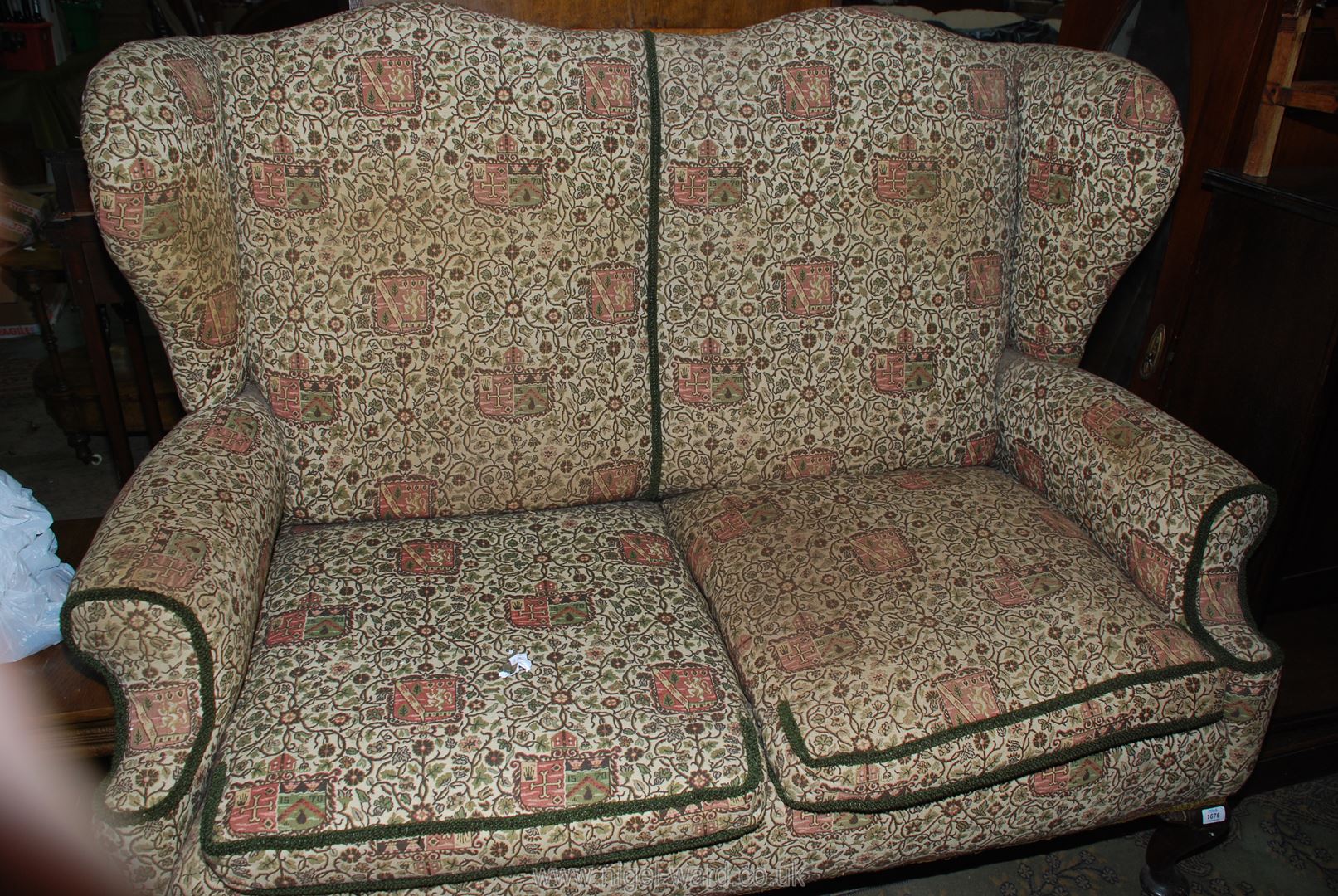 A pre 1950 Georgian design two seater Sofa having winged back and standing on brief Mahogany - Image 2 of 2