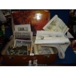 A vintage brown suitcase and contents of black and white photographs, coloured prints of cathedrals,