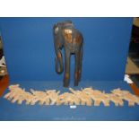 A wooden Elephant frieze 39'' long and another black Elephant.