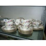 A Wedgwood 'Downland' part Teaset including nine cups, 12 saucers, cake and tea plates, milk jug,