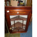 A circa 1900 Mahogany wall hanging Corner Cabinet having geometrically glazed seven pane door 33