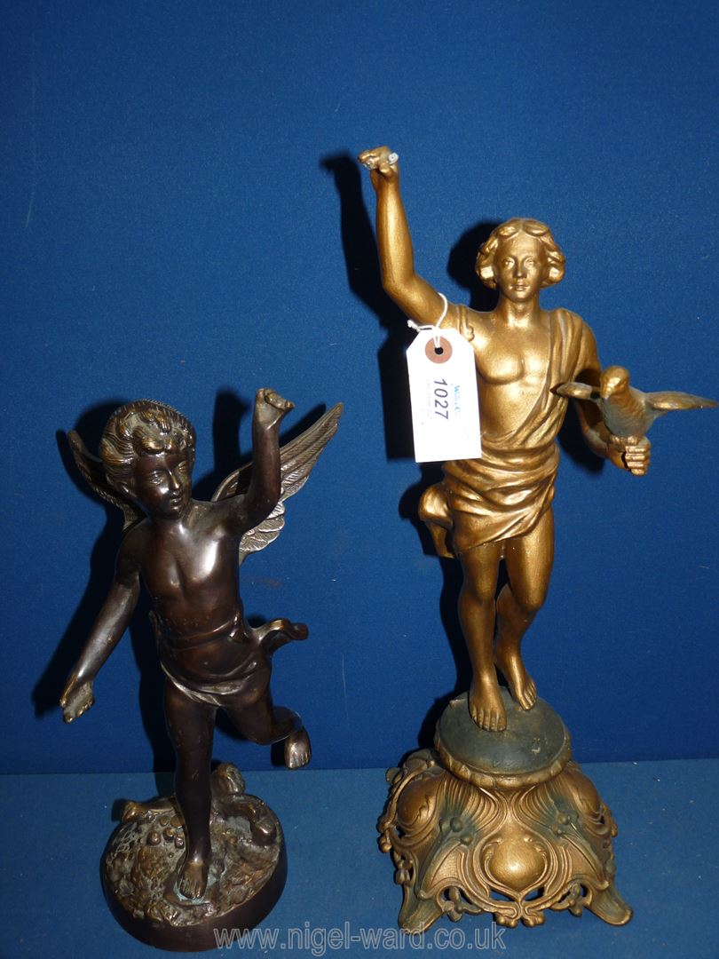 A cast metal figure of a cherub, 14'' tall and a metal figure of a man holding a bird, a/f,