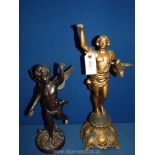 A cast metal figure of a cherub, 14'' tall and a metal figure of a man holding a bird, a/f,