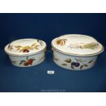 Two Royal Worcester Evesham gold casserole dishes; one large and one medium, (repaired).