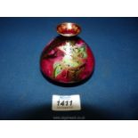 A delicate little Devon Sylvan Fairy Lustre vase in deep pink with delicate decorations.