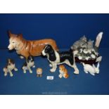 Two 1998 Castaga sitting Spaniel figures in brown, black and white,