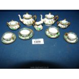 A very pretty Crown Staffordshire oriental design miniature Teaset with scenes of pagodas,