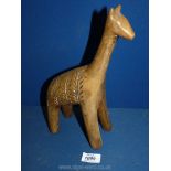 An African carved wooden animal figure.