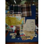 A quantity of miscellanea including two woollen throws, box camera, lens, old tin, maps,