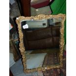 A wall Mirror in ornate gilt frame, 16'' x 22'', some damage to frame.