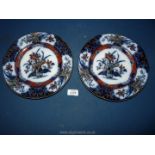 Two Wedgwood 'Iris' pattern wall plates, 10'' diameter.