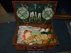 A Brexton wicker picnic hamper complete with china crockery and cutlery for six, Thermos flasks etc.