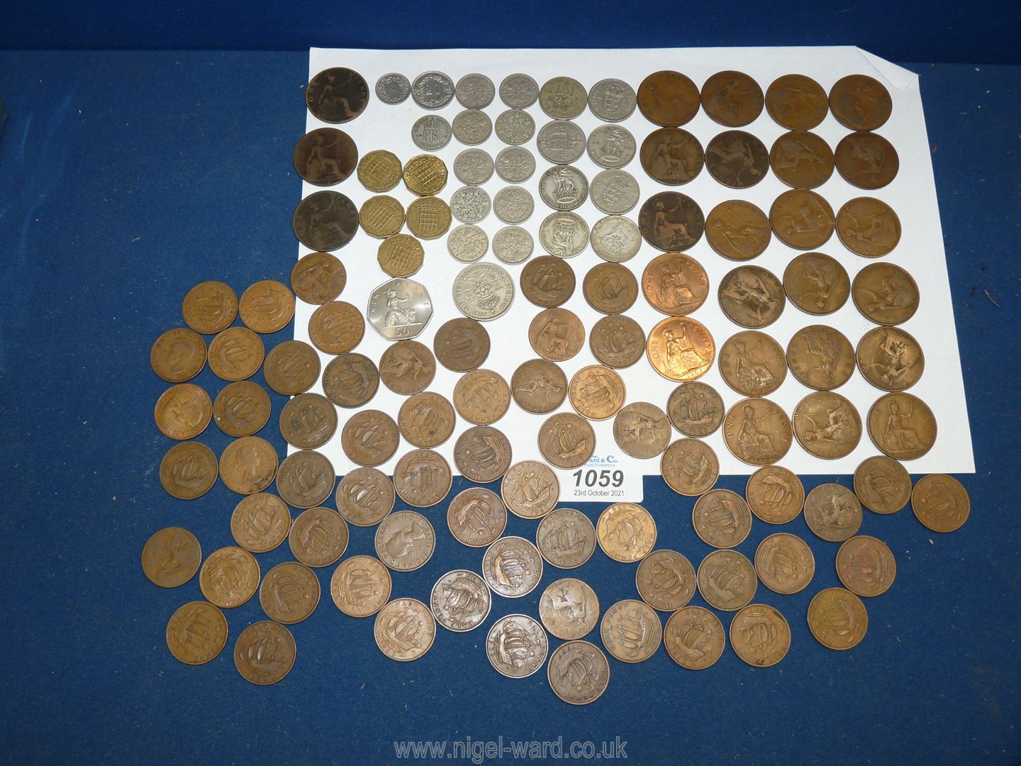 A quantity of pre decimal English coins including pennies, halfpennies, threepenny bits,