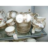 A Noritake Teaset in cream and gilding including teapot, eleven cups, twelve saucers and tea plates,