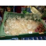 A large box of drinking glasses including champagne flutes, wine glasses, lemonade glasses etc.