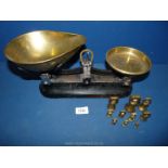 A brass and metal weighing Scales with brass weights.