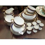 A Noritake china Teaset in white with blue and gold border to include two cake plates,