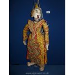 A Burmese Puppet having sequins and jewels on a glittering costume and headdress 28" long.