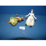 A vintage Mettoy clockwork dancer and another tinplate dancer.