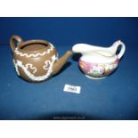 A Pearlware Chinoiserie jug and a brown Jasperware teapot, no lid.