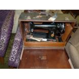 A cased hand Singer Sewing machine