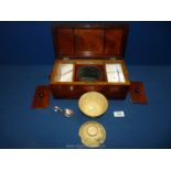 A Tea Caddy with marquetry bird decoration to lid containing two floral bowls, spoon, etc.