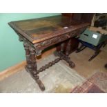 A most unusual Oak hall Centre Table standing on four turned and carved supports terminating in