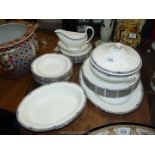 A Wedgwood 'Amherst' dinner service for eight including one lidded dish, two open dishes,