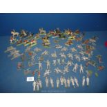 A large quantity of lead Cowboys and Indians, some having been painted.