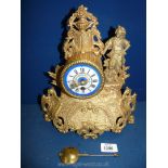 A 19th c. gilt metal and enamel Clock in the Rococo style, 11 1/2'' tall.