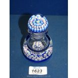 A heavy glass Scottish made paperweight style stoppered Bottle with blue millefiori pattern and