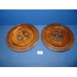Two carved wood wall Plates, labelled verso for Drzewna S-Pria., 10 1/2'' diameter.
