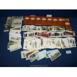 A quantity of cigarette cards including Doncella, Regent etc and empty packets.