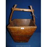 A vintage square primitive wooden Bucket, 16" x 23" tall.