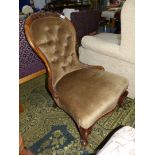 A darkwood show frame button backed Chair standing on scroll front legs and upholstered in brown