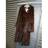 A brown mink fur Coat by Faulkes, Edgbaston Birmingham. Size M.