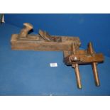 A wooden sash fillister or plough plane and large wooden Jack plane.