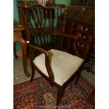 An elegant and delicate mahogany framed elbow chair having lattice style back rest,