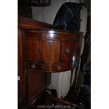 A Georgian Mahogany floor-standing corner wash-stand the hinged lid lifting to reveal a bowl recess