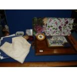 A handled wooden tray, two plastic trays, boxed set of Pimpernel placemats,