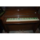 An unusual and compact "Bijouette" upright ship's type Piano,