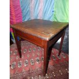 A square occasional Table on tapering square legs and having crossbanding to the top,